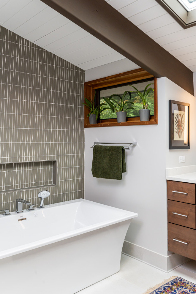 Photo of a medium sized retro ensuite bathroom in Other with flat-panel cabinets, dark wood cabinets, a freestanding bath, a corner shower, a one-piece toilet, grey tiles, glass tiles, grey walls, porcelain flooring, a submerged sink, engineered stone worktops, white floors, a hinged door, white worktops, double sinks, a floating vanity unit and exposed beams.