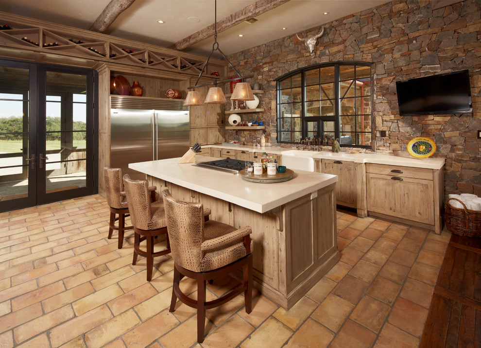 Inspiration for a country kitchen in Houston with recessed-panel cabinets and stainless steel appliances.