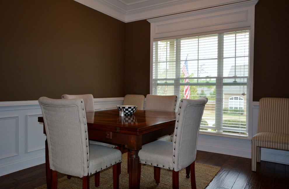 Inspiration for a small contemporary separate dining room in Atlanta with brown walls and medium hardwood floors.