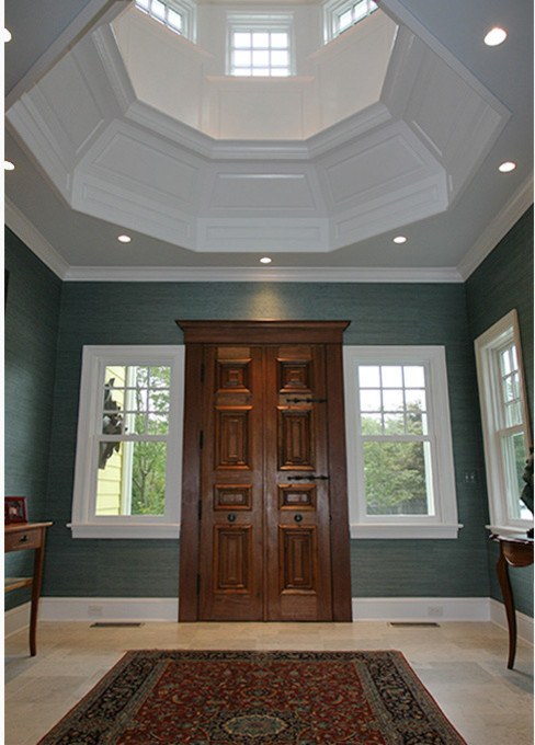 Front door - large transitional beige floor front door idea with blue walls and a dark wood front door