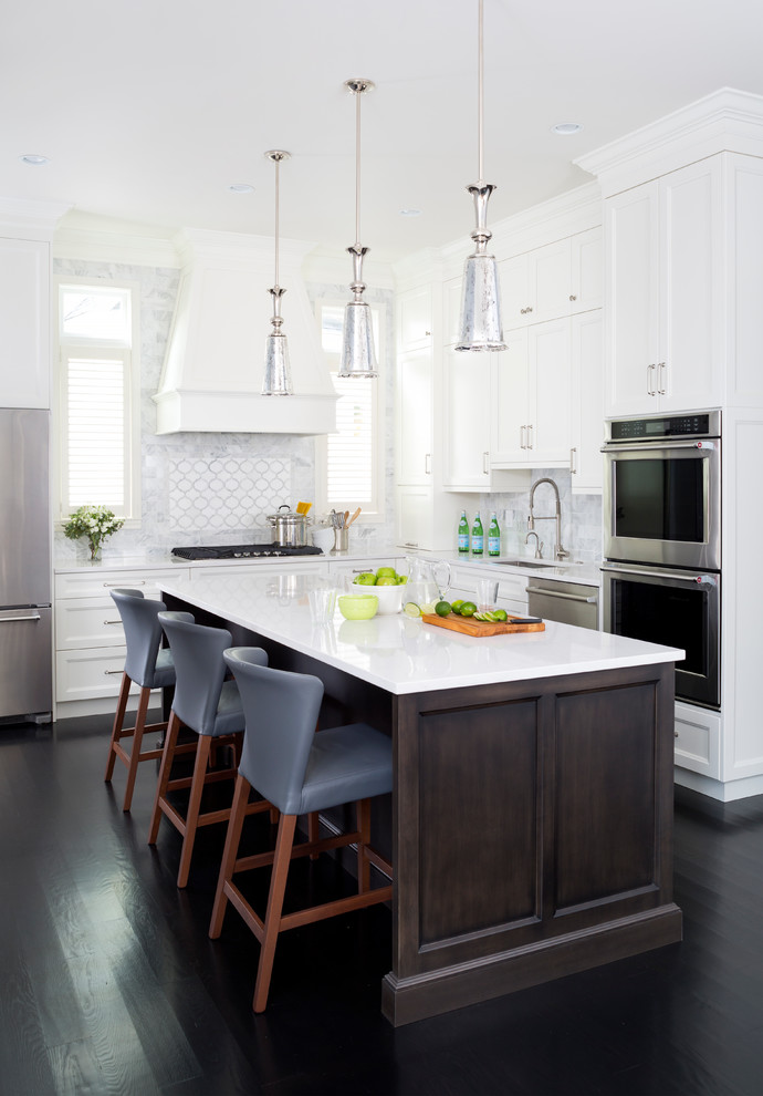 Inspiration for a transitional eat-in kitchen in DC Metro with an undermount sink, shaker cabinets, white cabinets, multi-coloured splashback, stainless steel appliances, dark hardwood floors and with island.