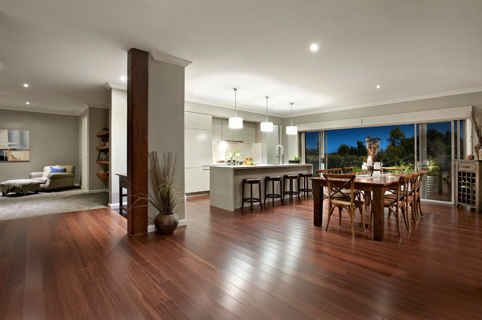 Large contemporary open concept family room in Sydney with beige walls and medium hardwood floors.