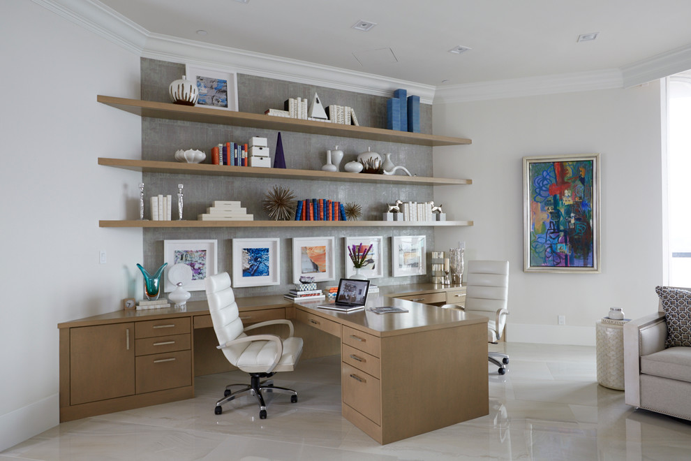 Photo of a mid-sized contemporary study room in New Orleans with marble floors, a built-in desk, white walls, no fireplace and white floor.