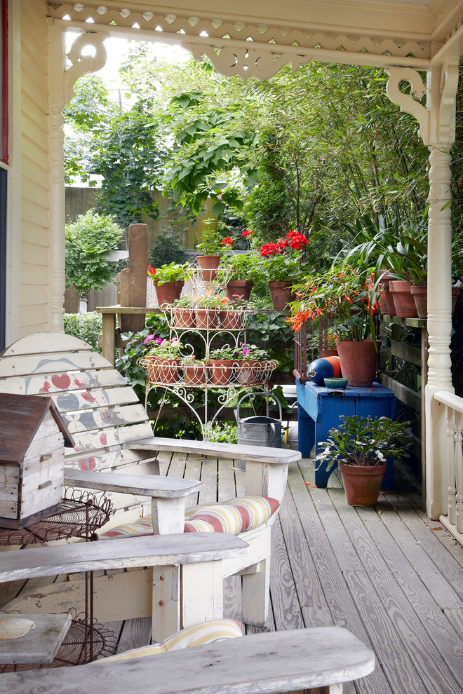 Inspiration for a beach style verandah in San Francisco with decking and a roof extension.