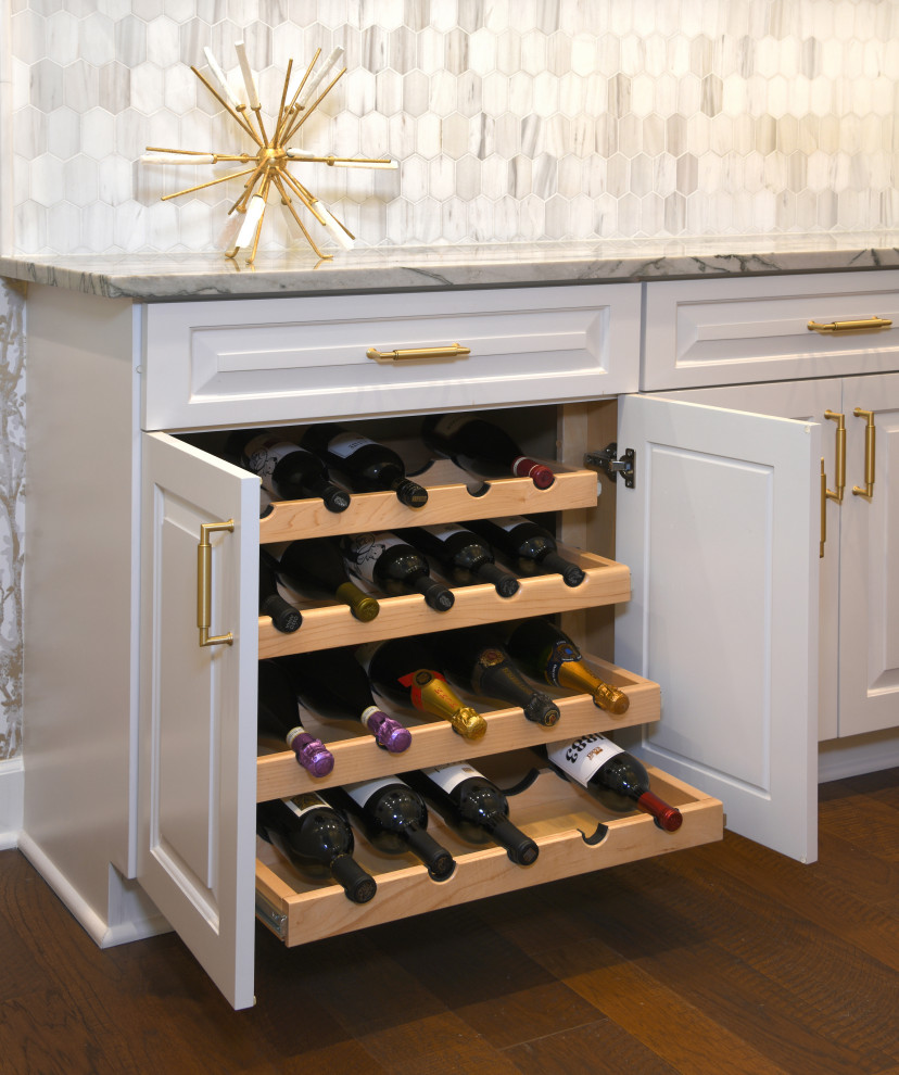 Mid-sized eclectic l-shaped wet bar in Houston with an undermount sink, raised-panel cabinets, white cabinets, marble benchtops, grey splashback, cement tile splashback, dark hardwood floors, brown floor and grey benchtop.