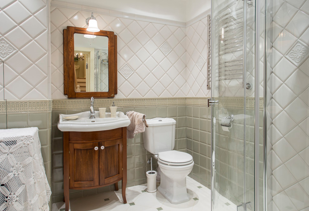 Photo of a bathroom in Moscow with medium wood cabinets, a two-piece toilet, green tile, white tile, a console sink, white floor and shaker cabinets.