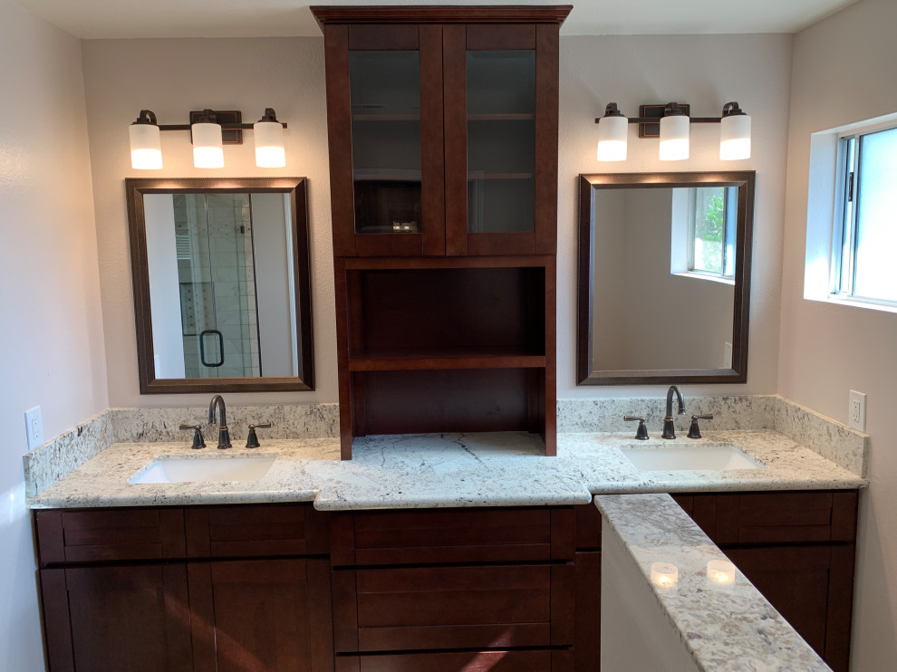 This is an example of a mid-sized modern master bathroom in Orange County with shaker cabinets, brown cabinets, an alcove shower, a two-piece toilet, beige walls, an undermount sink, quartzite benchtops, brown floor, a hinged shower door and beige benchtops.