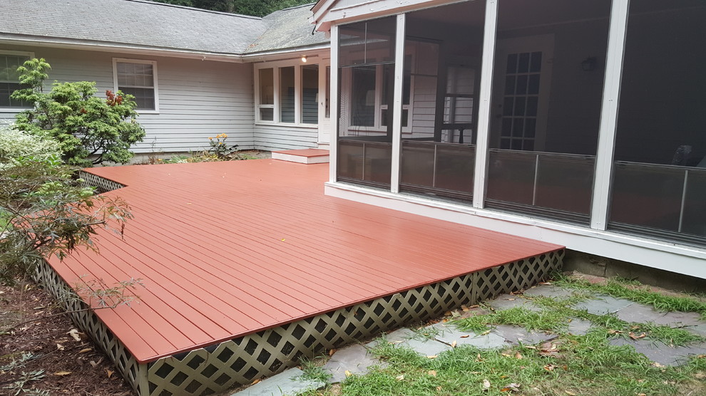 Inspiration for a mid-sized rustic backyard deck remodel in Boston with no cover