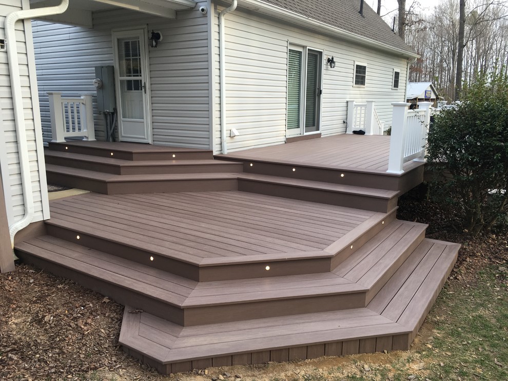Deck - large traditional backyard deck idea with no cover