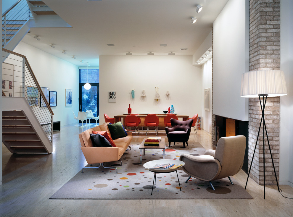 Inspiration for a large midcentury open concept living room in New York with white walls, ceramic floors, a standard fireplace, a brick fireplace surround, no tv and beige floor.