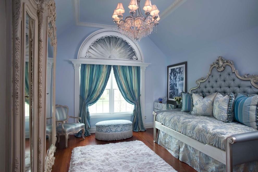 Traditional kids' room in New York with blue walls and dark hardwood floors for girls.