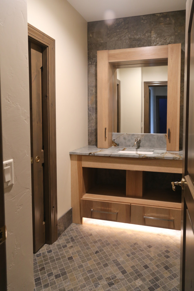 Alcove shower - mid-sized transitional kids' gray tile and stone tile slate floor, gray floor and single-sink alcove shower idea with flat-panel cabinets, medium tone wood cabinets, a two-piece toilet, white walls, an undermount sink, granite countertops, a hinged shower door, green countertops and a built-in vanity