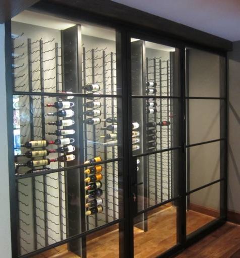 Design ideas for a small contemporary wine cellar in Dallas with storage racks and brown floor.