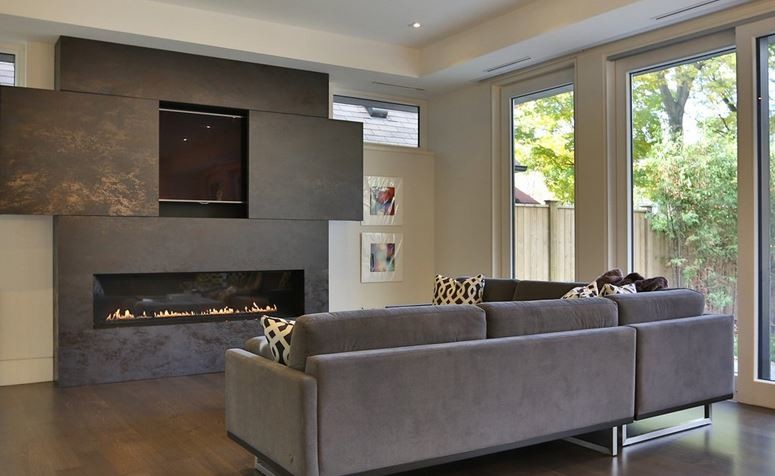 Photo of a mid-sized contemporary open concept living room in Toronto with white walls, medium hardwood floors, a ribbon fireplace, a tile fireplace surround and a concealed tv.