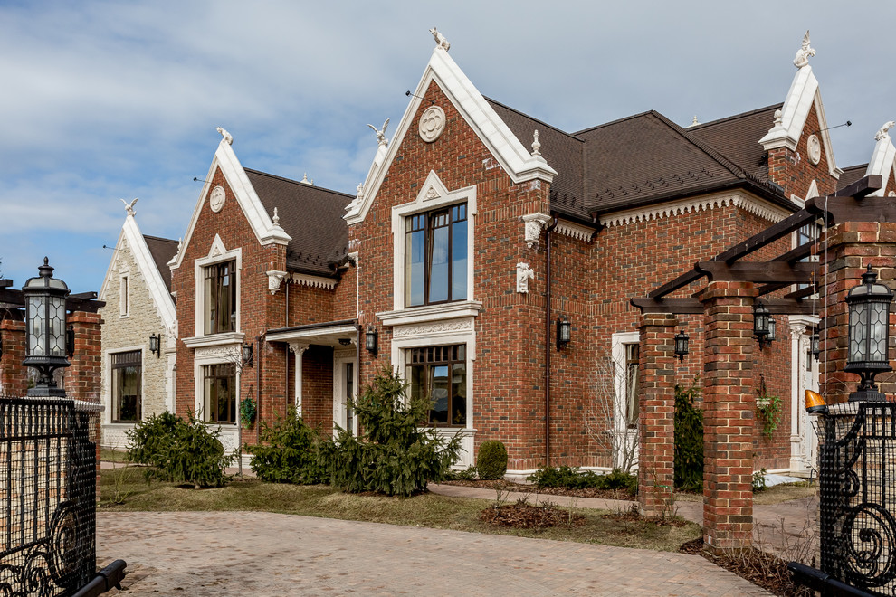 Traditional two-storey brick brown house exterior in Moscow.