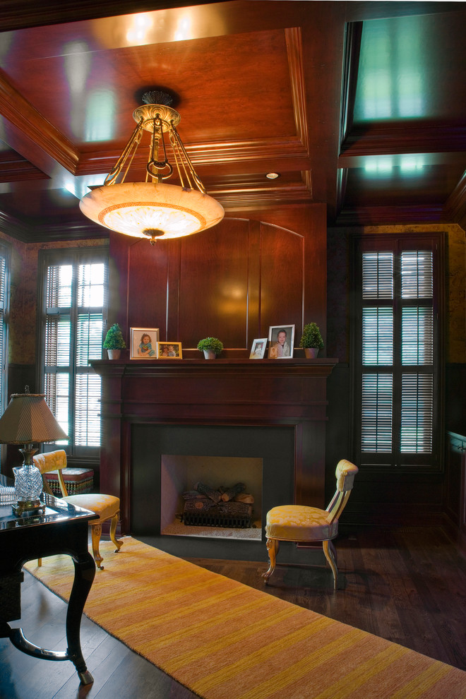Inspiration for a mid-sized transitional study room in Chicago with brown walls, dark hardwood floors, a standard fireplace, a stone fireplace surround and a freestanding desk.