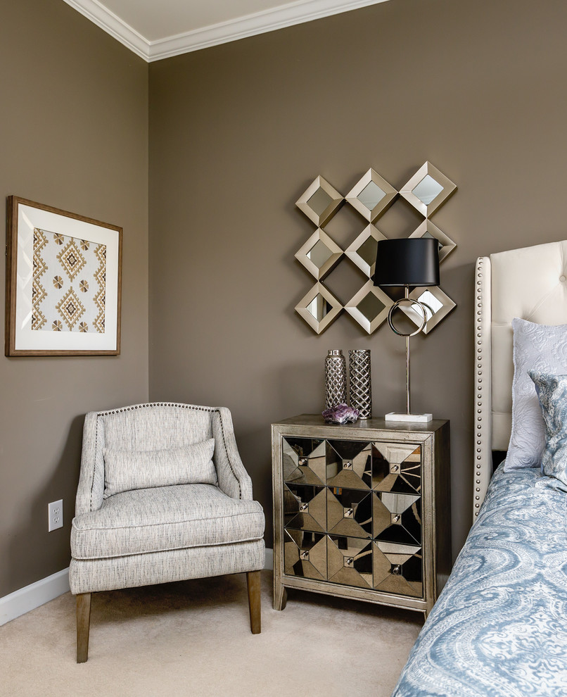 Inspiration for a mid-sized traditional master bedroom in Raleigh with brown walls and carpet.