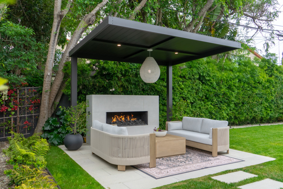 Patio - contemporary patio idea in Los Angeles with a fireplace