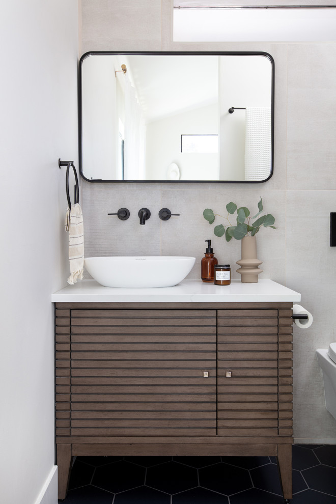 Small midcentury master bathroom in San Diego with brown cabinets, an open shower, beige tile, ceramic tile, white walls, porcelain floors, a vessel sink, engineered quartz benchtops, black floor, white benchtops, a single vanity and a freestanding vanity.
