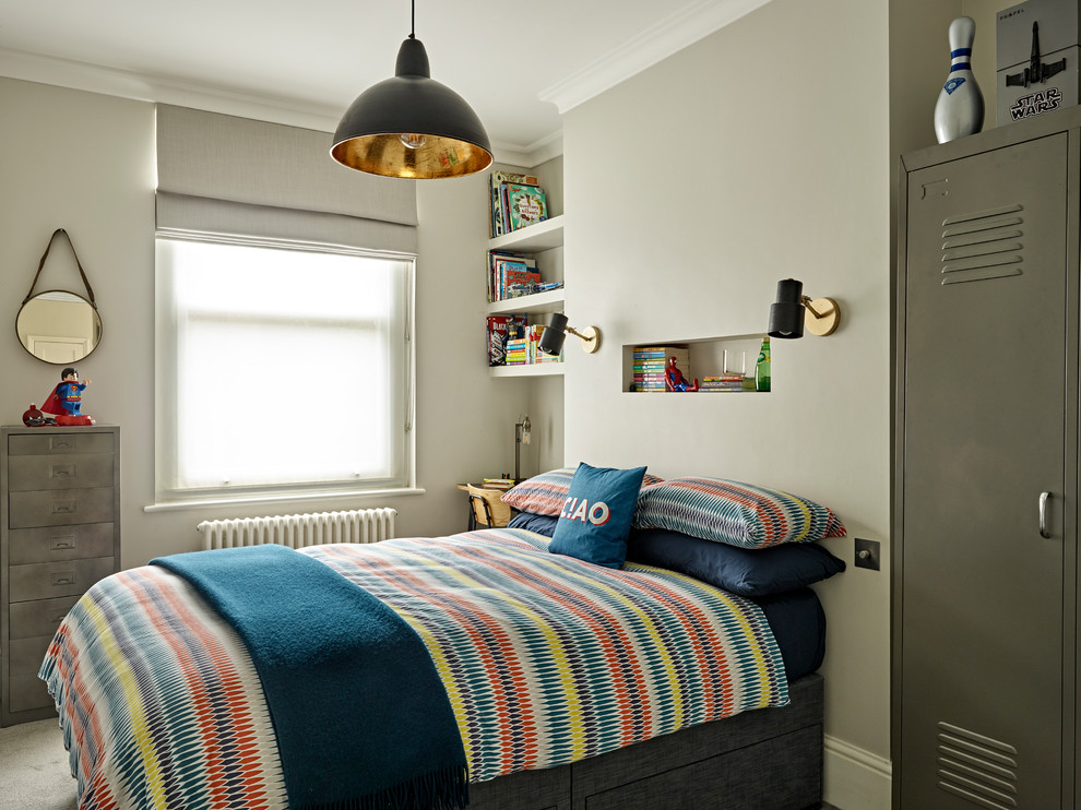 This is an example of an eclectic kids' room for kids 4-10 years old and boys in London with grey walls, carpet and grey floor.