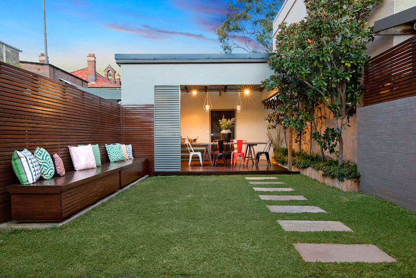 Design ideas for a contemporary backyard garden in Sydney with concrete pavers.