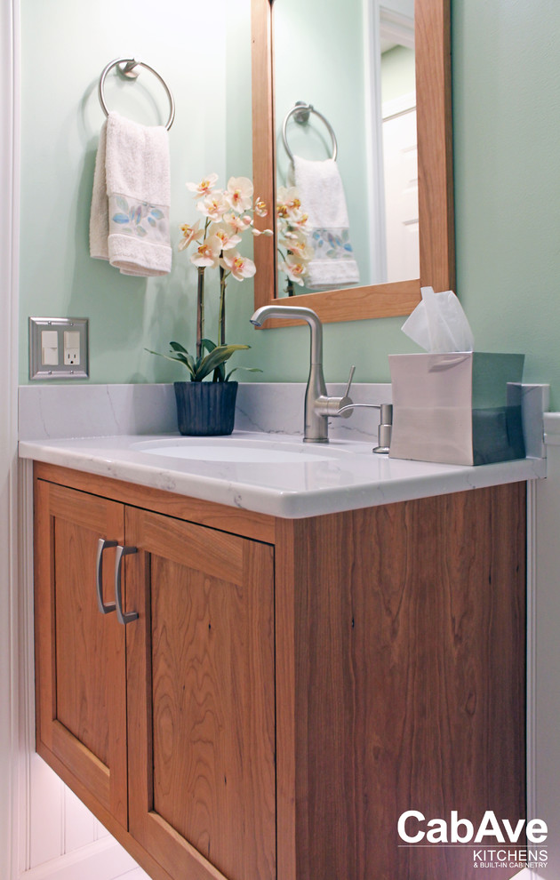 Bathroom - small transitional white floor bathroom idea with recessed-panel cabinets, light wood cabinets and green walls