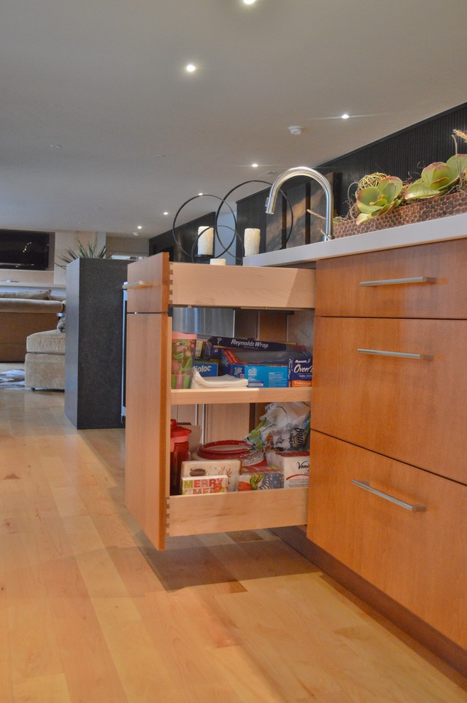 Inspiration for a large light wood floor kitchen remodel with flat-panel cabinets, dark wood cabinets, quartzite countertops, white backsplash, stone slab backsplash, stainless steel appliances and an island