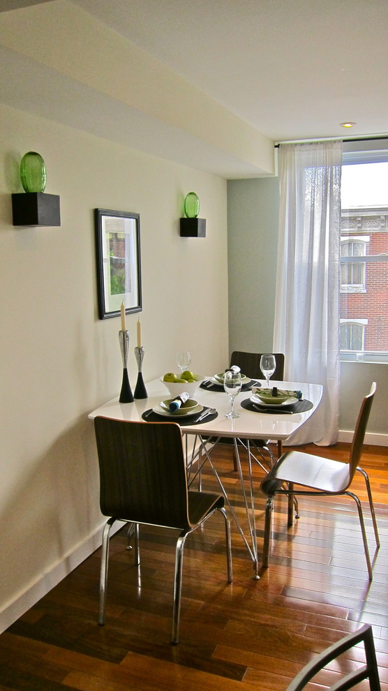 This is an example of a contemporary dining room in Philadelphia with dark hardwood floors.