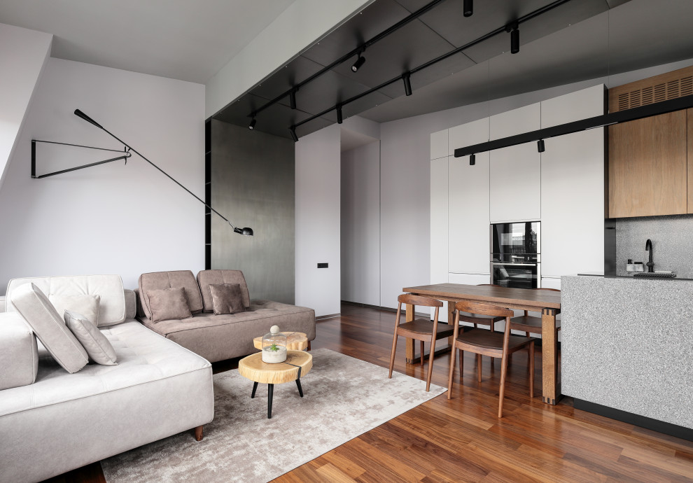 Inspiration för mellanstora minimalistiska vardagsrum, med vita väggar