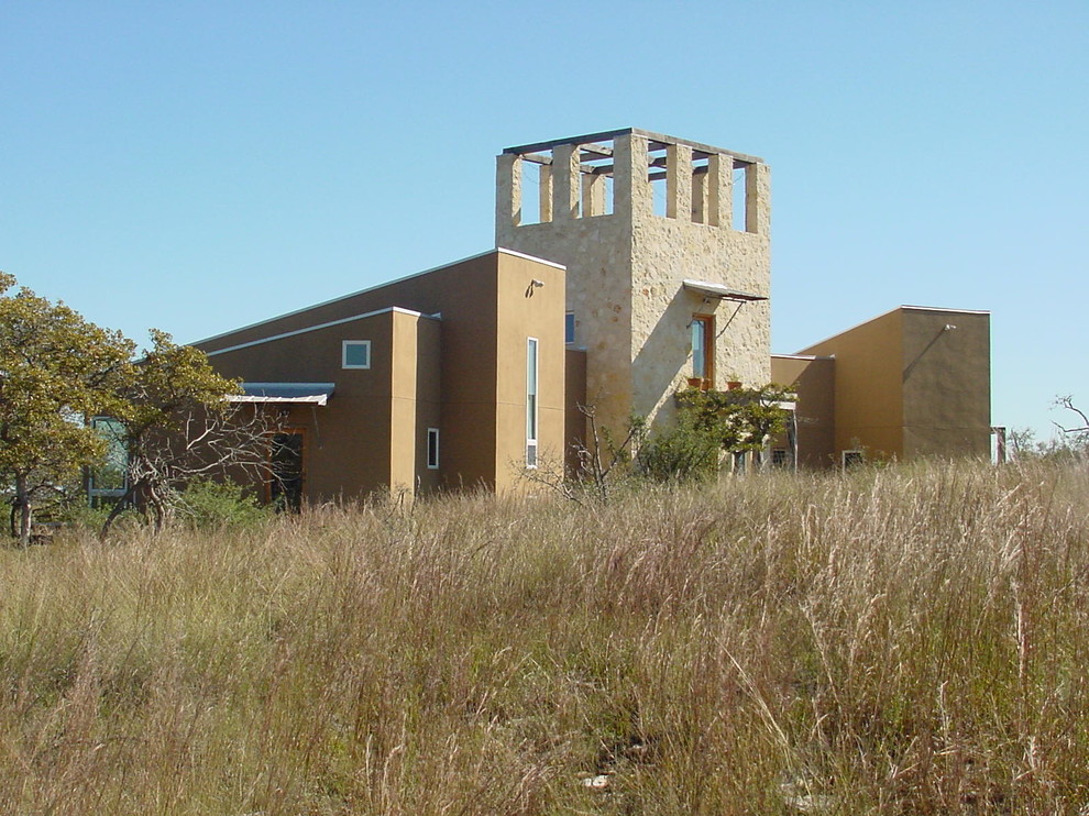 Example of an eclectic home design design in Austin