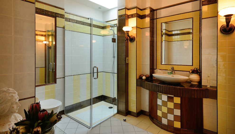 Mid-sized transitional 3/4 bathroom in Auckland with a corner shower, a one-piece toilet, white tile, yellow tile, yellow walls, a vessel sink and a hinged shower door.