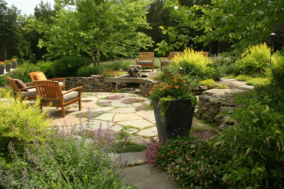 This is an example of a country patio in Philadelphia with a fire feature.