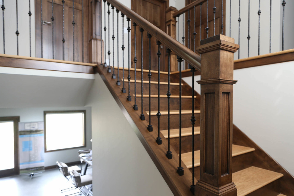 Inspiration for a mid-sized traditional wood u-shaped staircase in Other with wood risers and mixed railing.