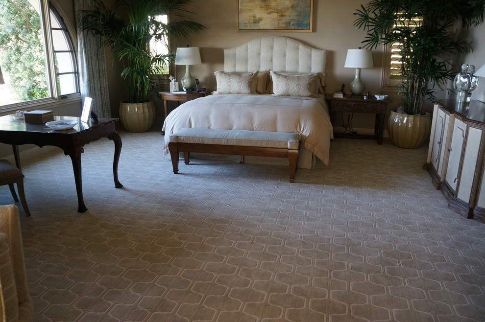 Design ideas for a large traditional master bedroom in Orange County with beige walls, carpet and no fireplace.