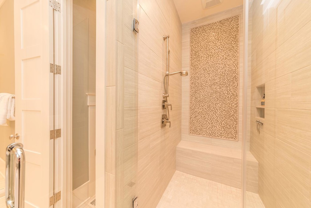 This is an example of a mid-sized transitional master bathroom in Atlanta with beaded inset cabinets, white cabinets, a freestanding tub, an alcove shower, beige tile, porcelain tile, grey walls, porcelain floors, an undermount sink, granite benchtops, beige floor and a hinged shower door.