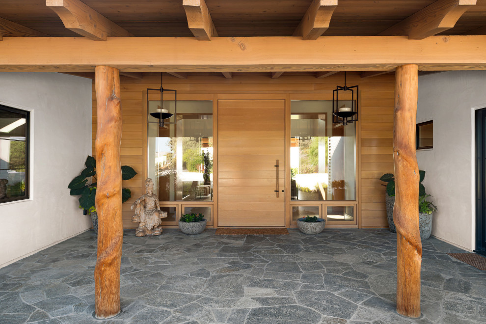 Example of a large transitional home design design