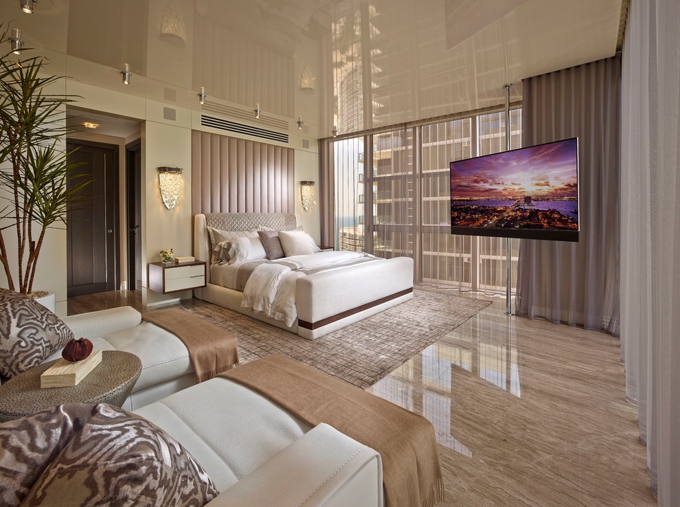 Inspiration for a large contemporary master bedroom in Miami with marble floors.