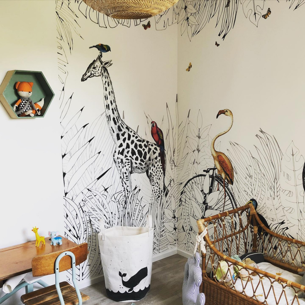 This is an example of a mid-sized tropical gender-neutral kids' room in Toulouse with vinyl floors and wallpaper.