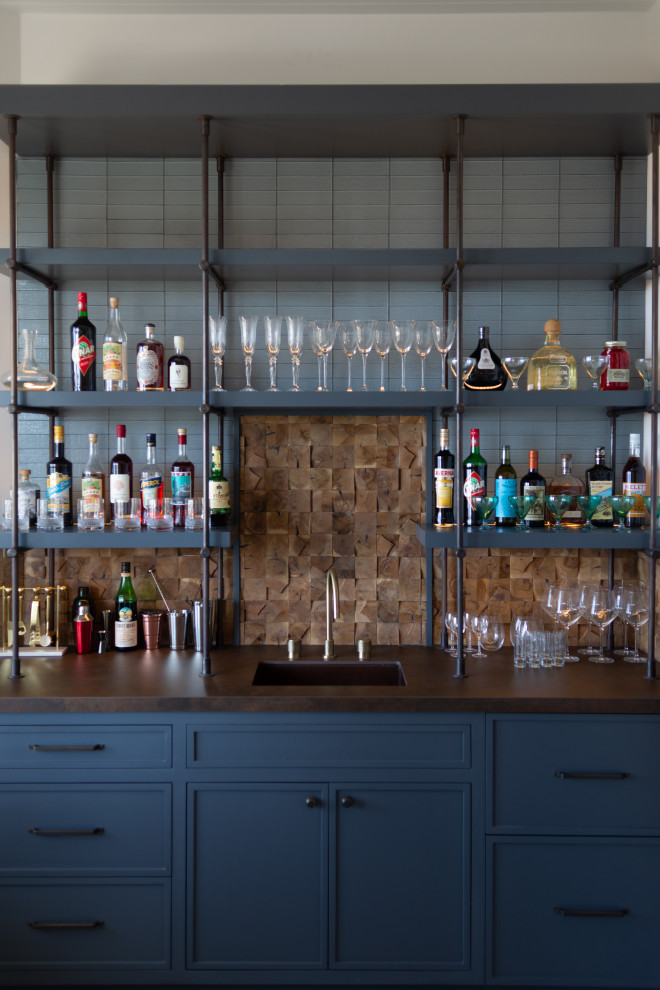 Photo of a medium sized eclectic single-wall wet bar in Los Angeles with a submerged sink, shaker cabinets, blue cabinets, engineered stone countertops, brown splashback, wood splashback, concrete flooring, grey floors and brown worktops.