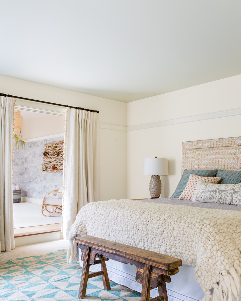 Design ideas for an eclectic master bedroom in San Francisco with beige walls and no fireplace.