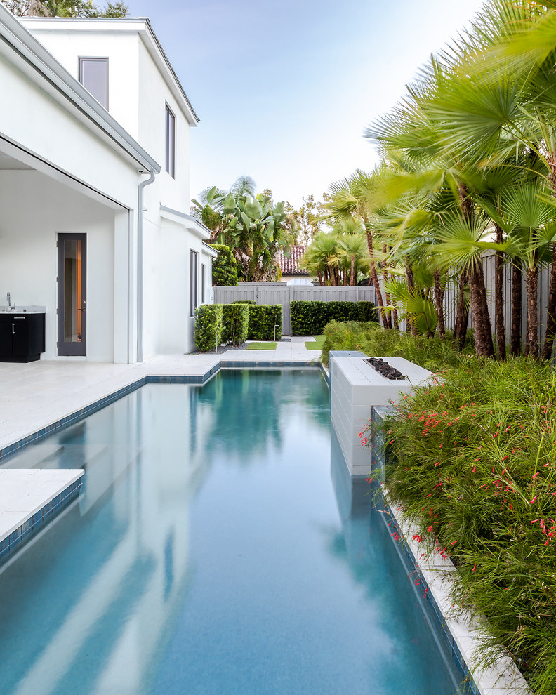 Photo of a contemporary backyard rectangular lap pool in Orlando.