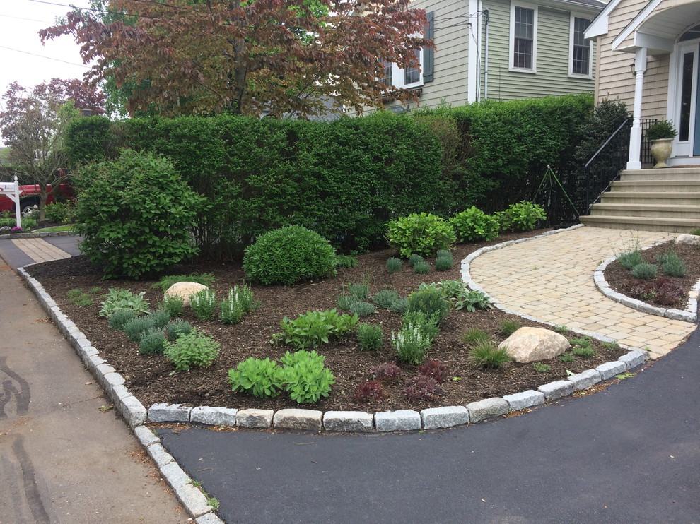 This is an example of a small beach style front yard full sun xeriscape in New York.