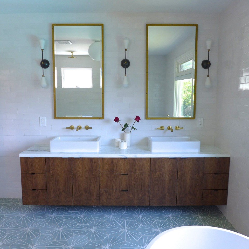 Design ideas for a contemporary master bathroom in Los Angeles with flat-panel cabinets, dark wood cabinets, a freestanding tub, an open shower, a one-piece toilet, white tile, ceramic tile, white walls, cement tiles, marble benchtops, green floor and an open shower.