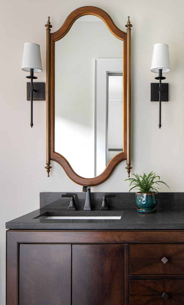 Inspiration for a large transitional master wet room bathroom in Atlanta with furniture-like cabinets, dark wood cabinets, white tile, engineered quartz benchtops, grey benchtops, a one-piece toilet, subway tile, beige walls, ceramic floors, an undermount sink, grey floor and a hinged shower door.
