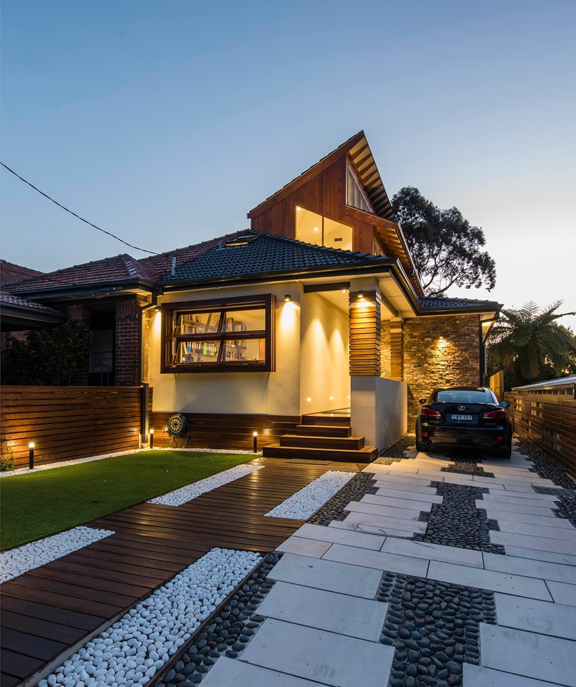 Inspiration for a mid-sized modern two-storey brown house exterior in Melbourne with mixed siding.