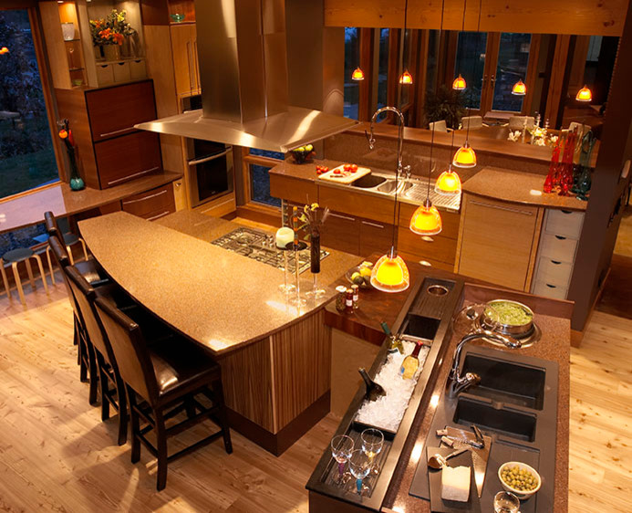 Mid-sized transitional u-shaped light wood floor eat-in kitchen photo with an undermount sink, flat-panel cabinets, medium tone wood cabinets, granite countertops, stone tile backsplash, stainless steel appliances and an island