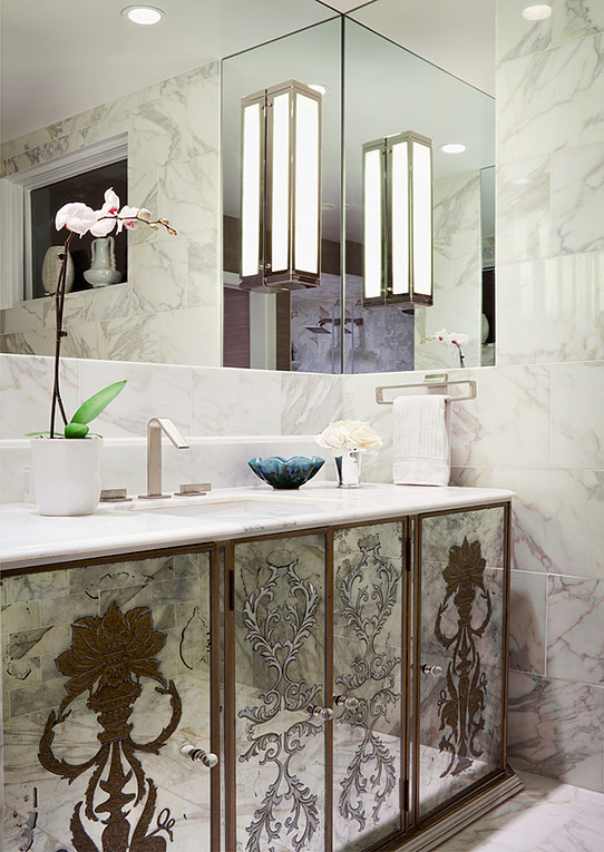 Mid-sized transitional master bathroom in New York with glass-front cabinets, grey cabinets, an alcove shower, a two-piece toilet, white tile, marble, white walls, marble floors, an undermount sink, marble benchtops, white floor, a hinged shower door and white benchtops.