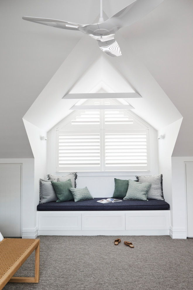 Photo of a mid-sized loft-style bedroom in Other with white walls, carpet, grey floor and vaulted.