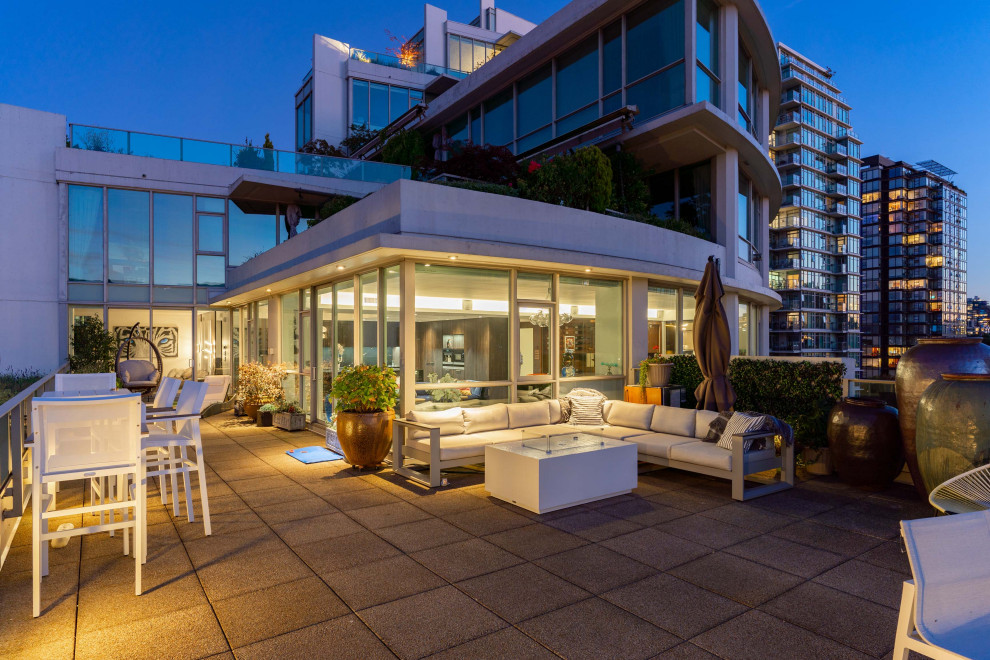 Inspiration for a contemporary first floor deck in Vancouver with no cover and metal railing.