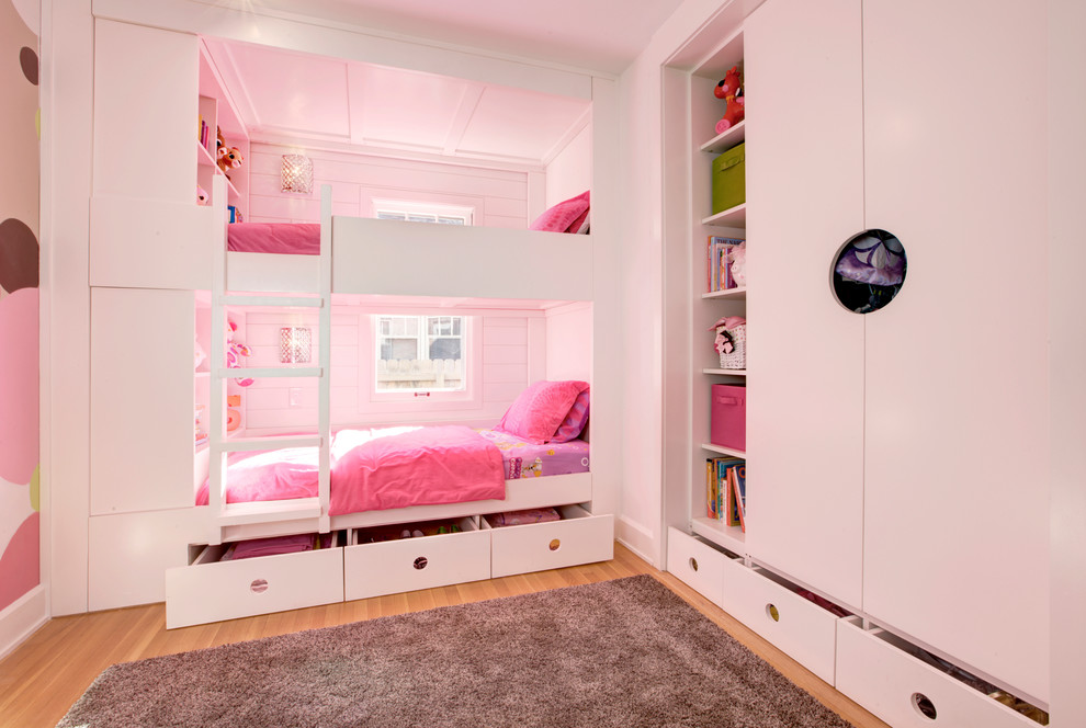 Irvington Modern Tudor - Custom Bunk Beds integrate storage cubbies within and roller-drawers beneath.  Original storage closet to right opened-up to create full-integrated millwork closet system to match with bunks - Architect:  HAUS | Architecture - Construction:  WERK | Build - Photo:  HAUS | Architecture